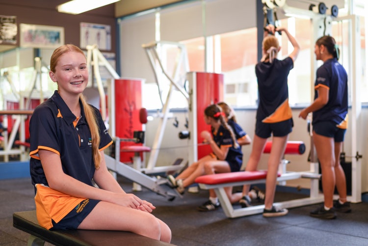 5 students doing a gym workout.