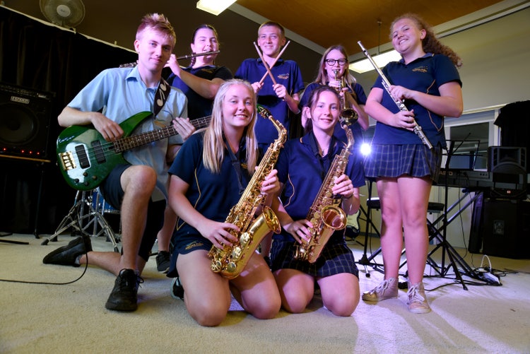 7 Students playing instruments.